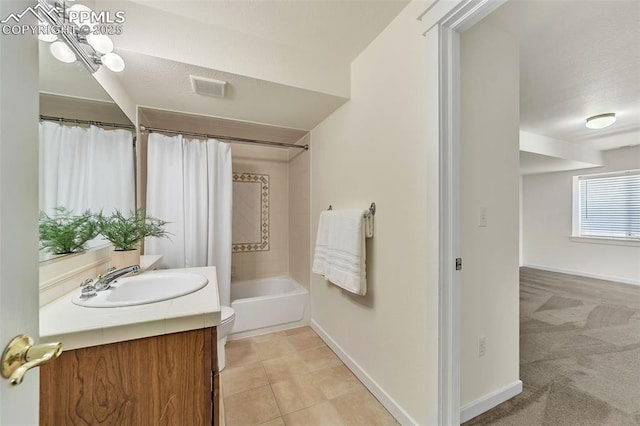 full bathroom featuring tile patterned flooring, vanity, shower / tub combo, and toilet