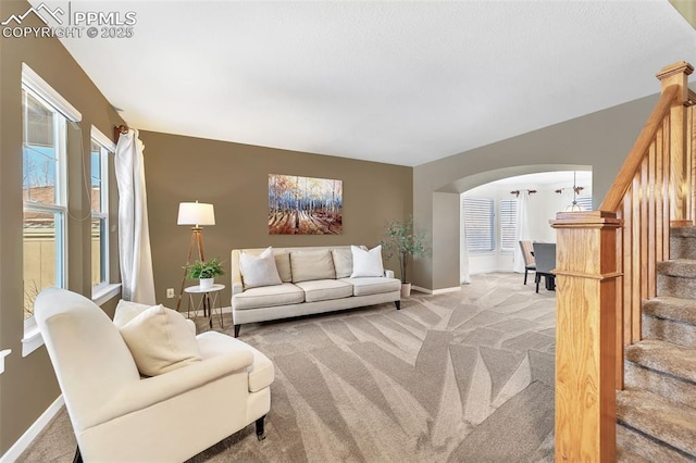 carpeted living room featuring a wealth of natural light