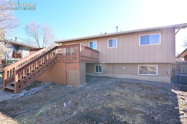 back of property featuring a deck