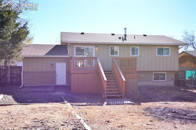 back of house featuring a deck