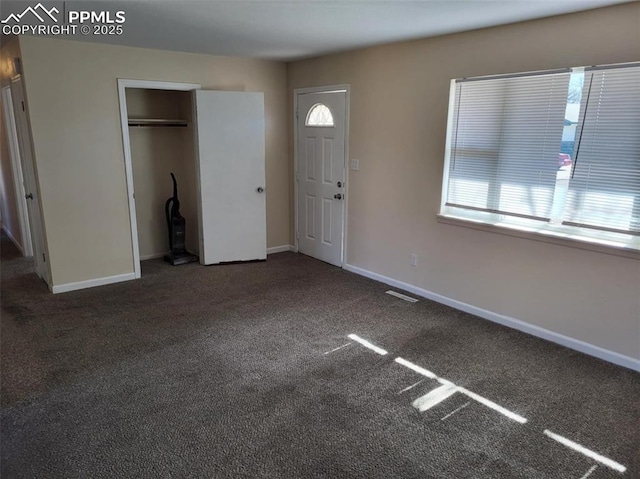 entrance foyer featuring carpet, visible vents, and baseboards