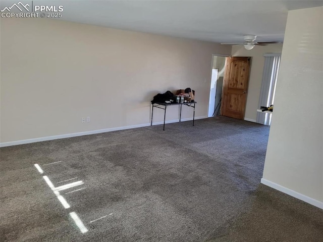 spare room with carpet floors, baseboards, and a ceiling fan