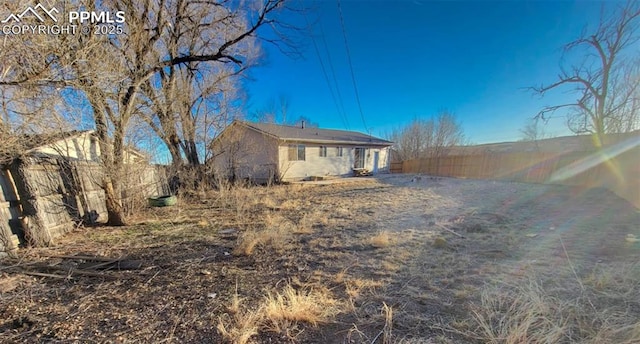 view of home's exterior featuring fence