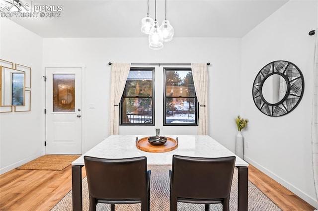 dining room with light wood-type flooring