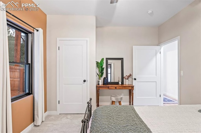 bedroom with light colored carpet