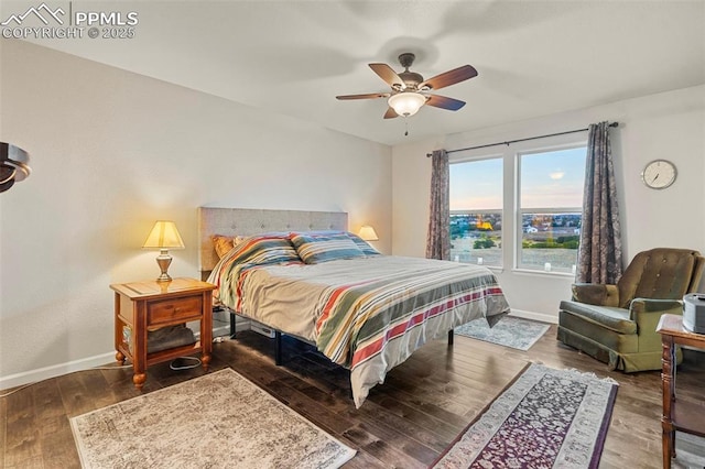 bedroom featuring ceiling fan and dark hardwood / wood-style floors