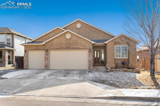 view of front facade with a garage, concrete driveway, stone siding, and stucco siding