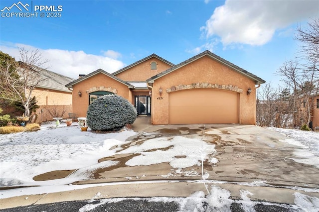 view of front of property featuring a garage