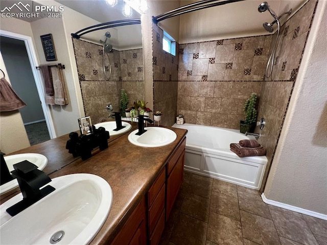 bathroom with tiled shower / bath combo and vanity