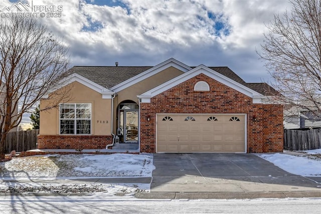 single story home with a garage