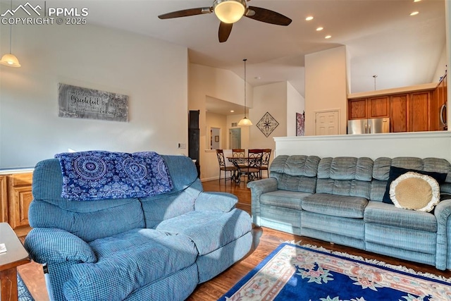 living room with hardwood / wood-style floors and ceiling fan