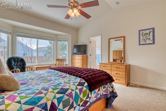 bedroom with vaulted ceiling, multiple windows, ceiling fan, and carpet