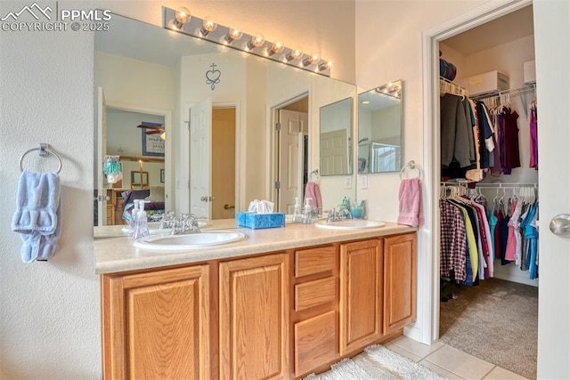 bathroom with vanity and tile patterned flooring