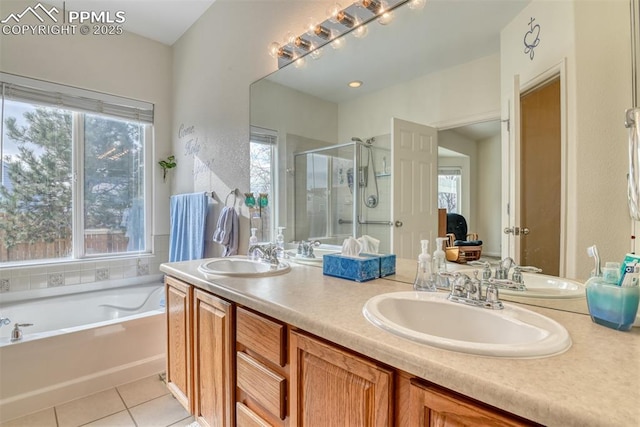 bathroom featuring independent shower and bath, tile patterned flooring, and vanity