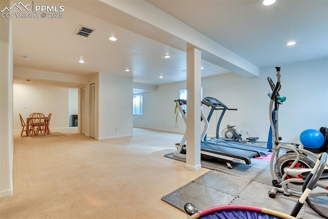 workout room with light colored carpet