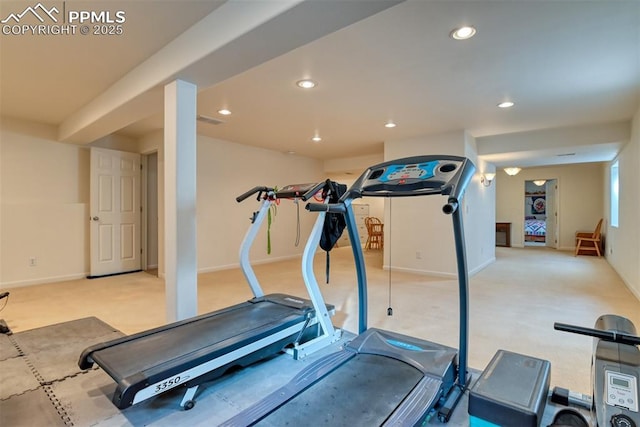 exercise area featuring light colored carpet