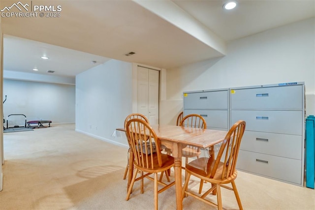 view of carpeted dining area