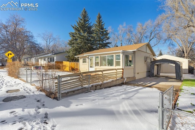 view of front of property with a carport