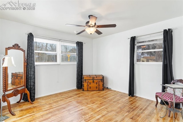 interior space featuring ceiling fan and light hardwood / wood-style flooring