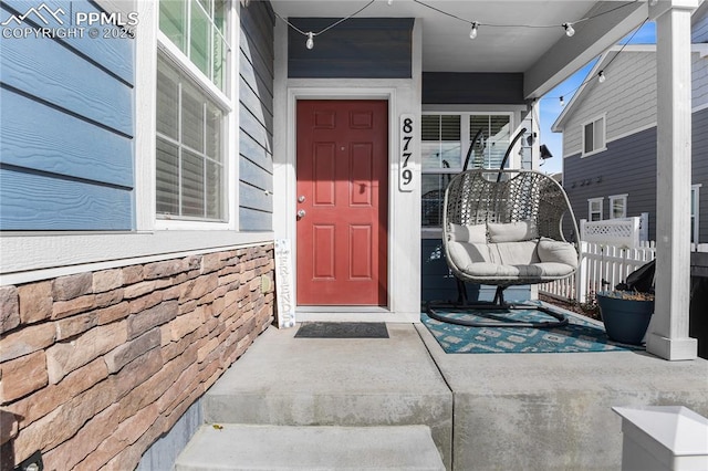 doorway to property with a porch