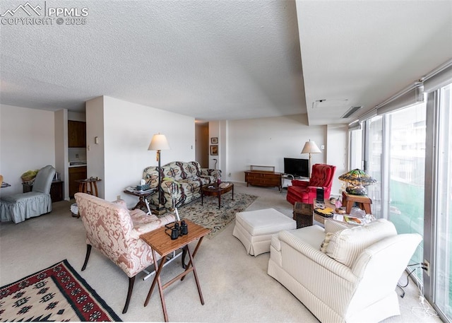 carpeted living room featuring expansive windows and a textured ceiling