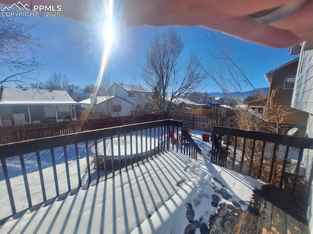 view of snow covered deck