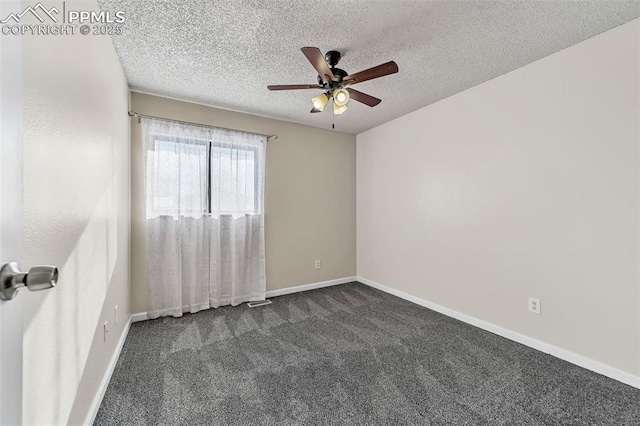 carpeted spare room featuring ceiling fan and a textured ceiling