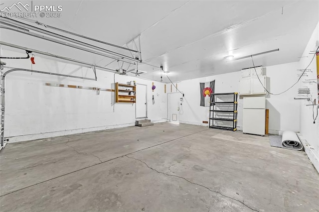 garage featuring white refrigerator