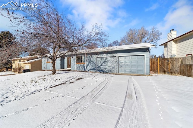 ranch-style home with a garage