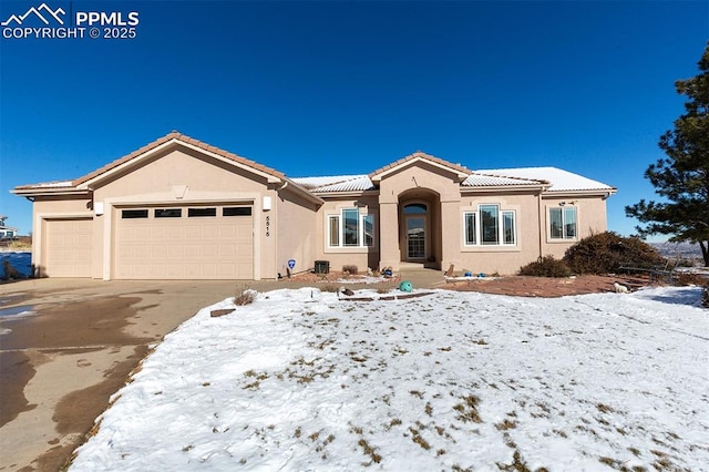 view of front of property with a garage