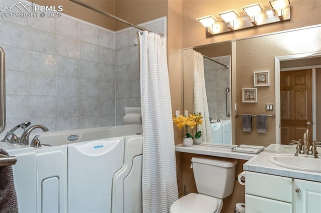 full bathroom with vanity, toilet, and independent shower and bath