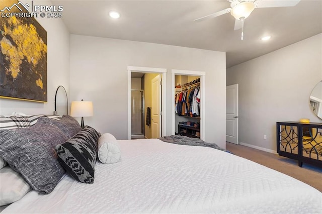 bedroom featuring ceiling fan, a closet, carpet floors, and a spacious closet