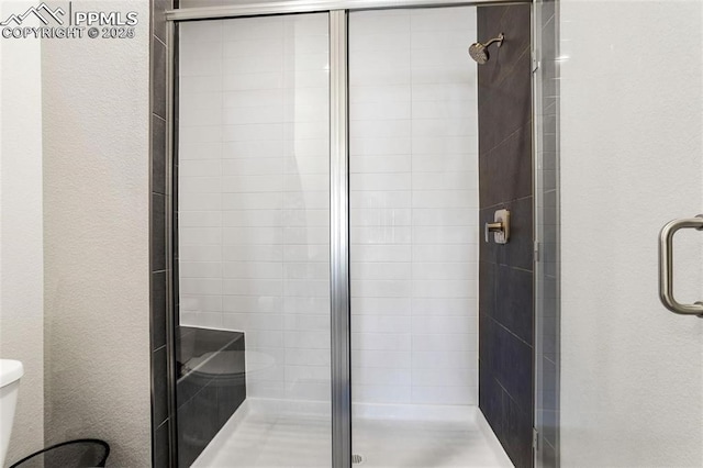 bathroom featuring an enclosed shower