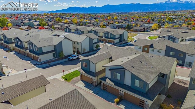 birds eye view of property with a mountain view