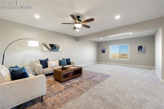 living room featuring ceiling fan and carpet