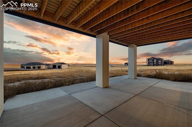 view of patio terrace at dusk