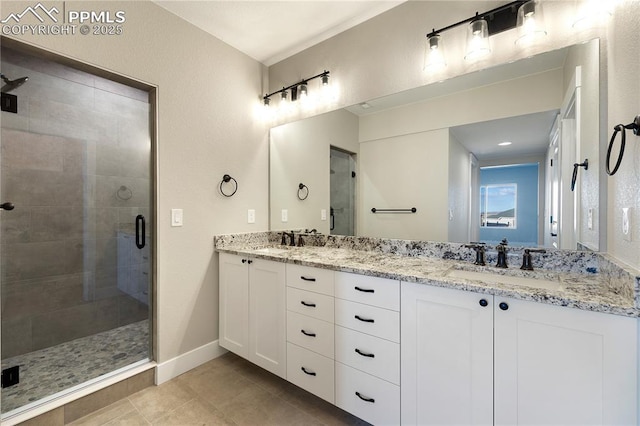 bathroom with tile patterned floors, vanity, and walk in shower