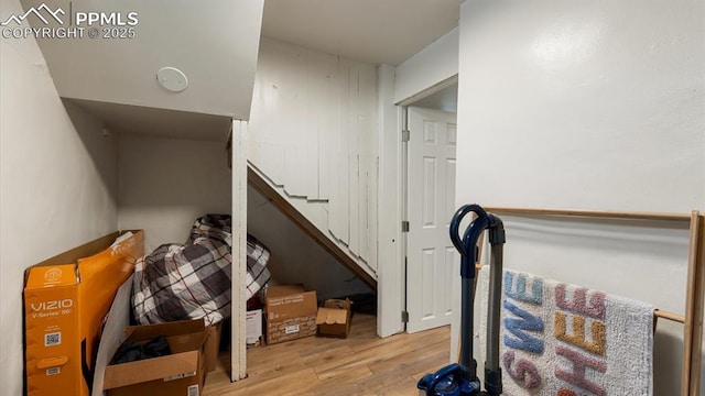 staircase featuring wood finished floors