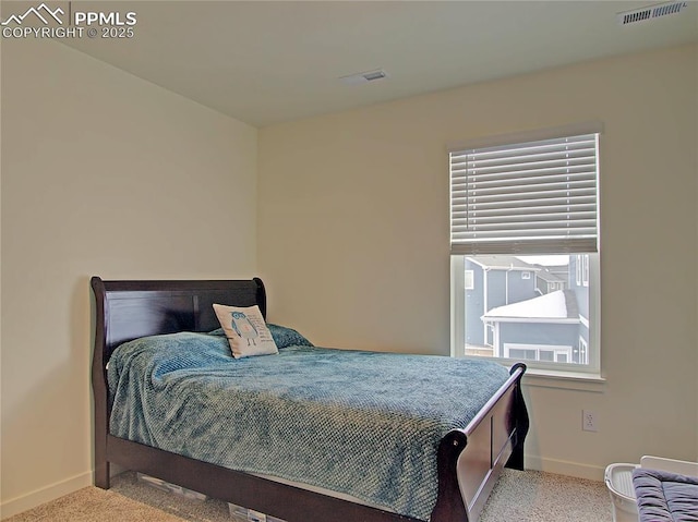 bedroom featuring light carpet