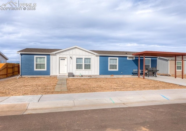 view of front of home with a carport