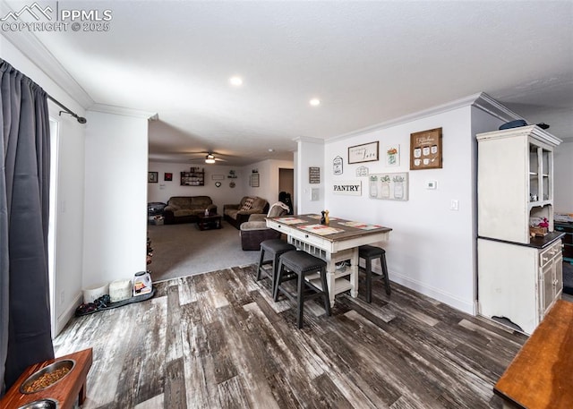 dining space featuring crown molding, ceiling fan, and dark hardwood / wood-style floors