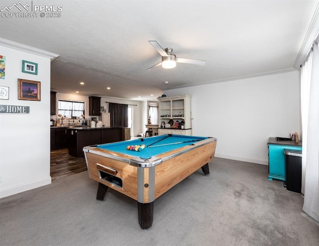 recreation room featuring ceiling fan, crown molding, dark carpet, and billiards