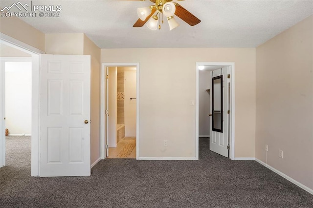 unfurnished bedroom featuring ceiling fan and dark carpet