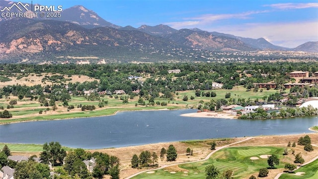 drone / aerial view with a water and mountain view