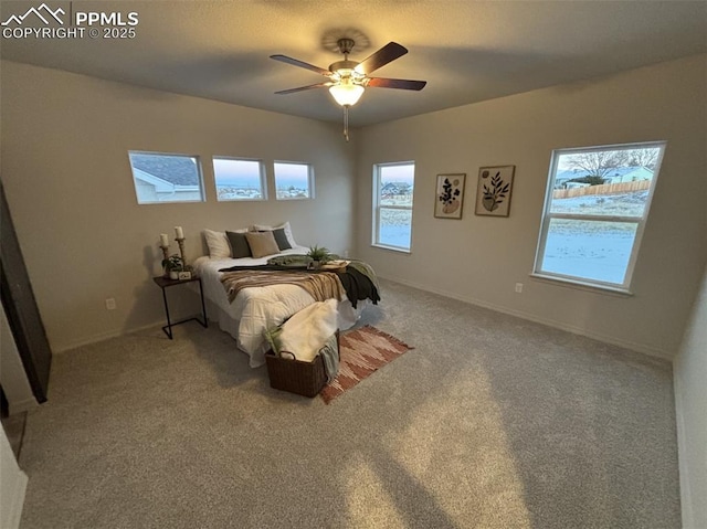 bedroom with ceiling fan and carpet floors