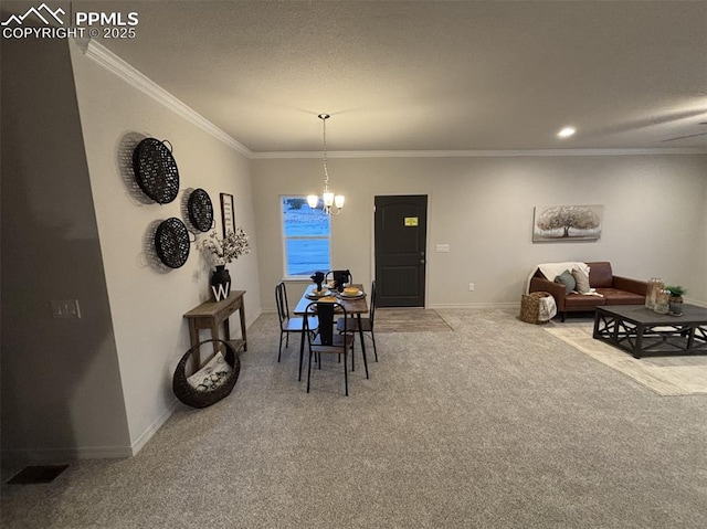 dining room featuring ornamental molding, carpet floors, and an inviting chandelier