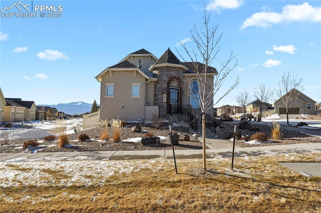 view of front of home featuring a mountain view