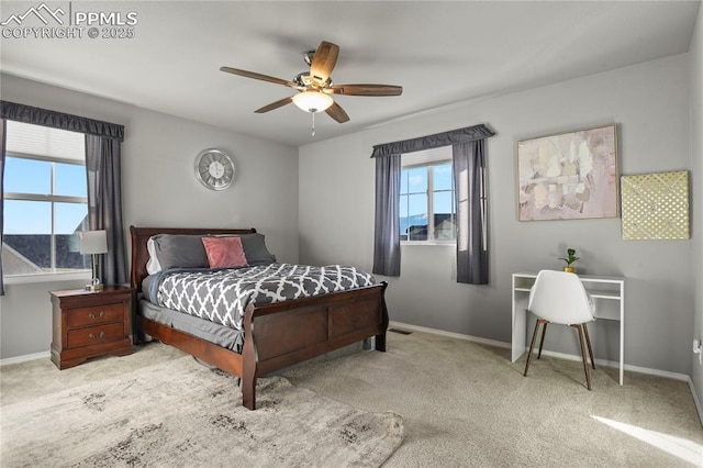 bedroom featuring ceiling fan and light colored carpet