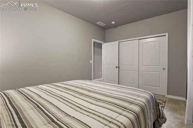 carpeted bedroom with a closet