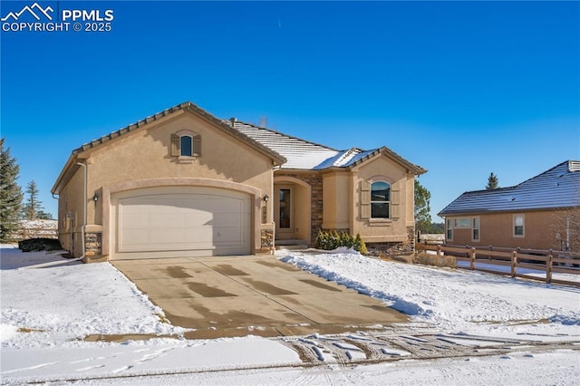 view of front of property with a garage